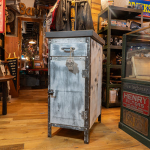 A vintage metal end table in a vintage store.